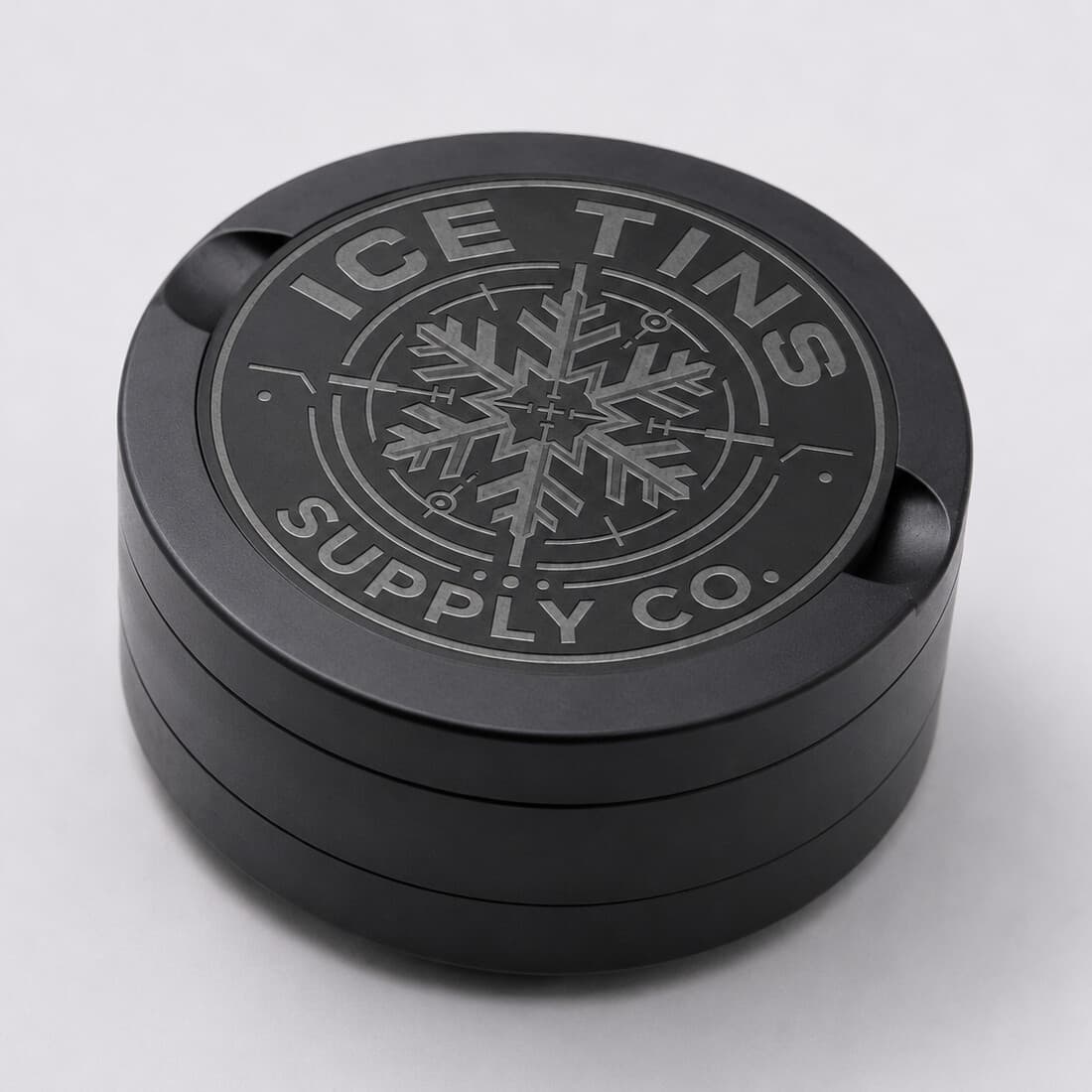 The Ice Tin at an angle, showing the machined lid and the three stacked floors